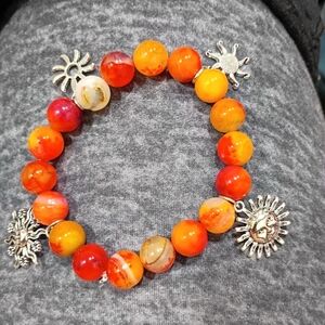 Hand Crafted Fire Agate With Sun Charms Stretched Bracelet